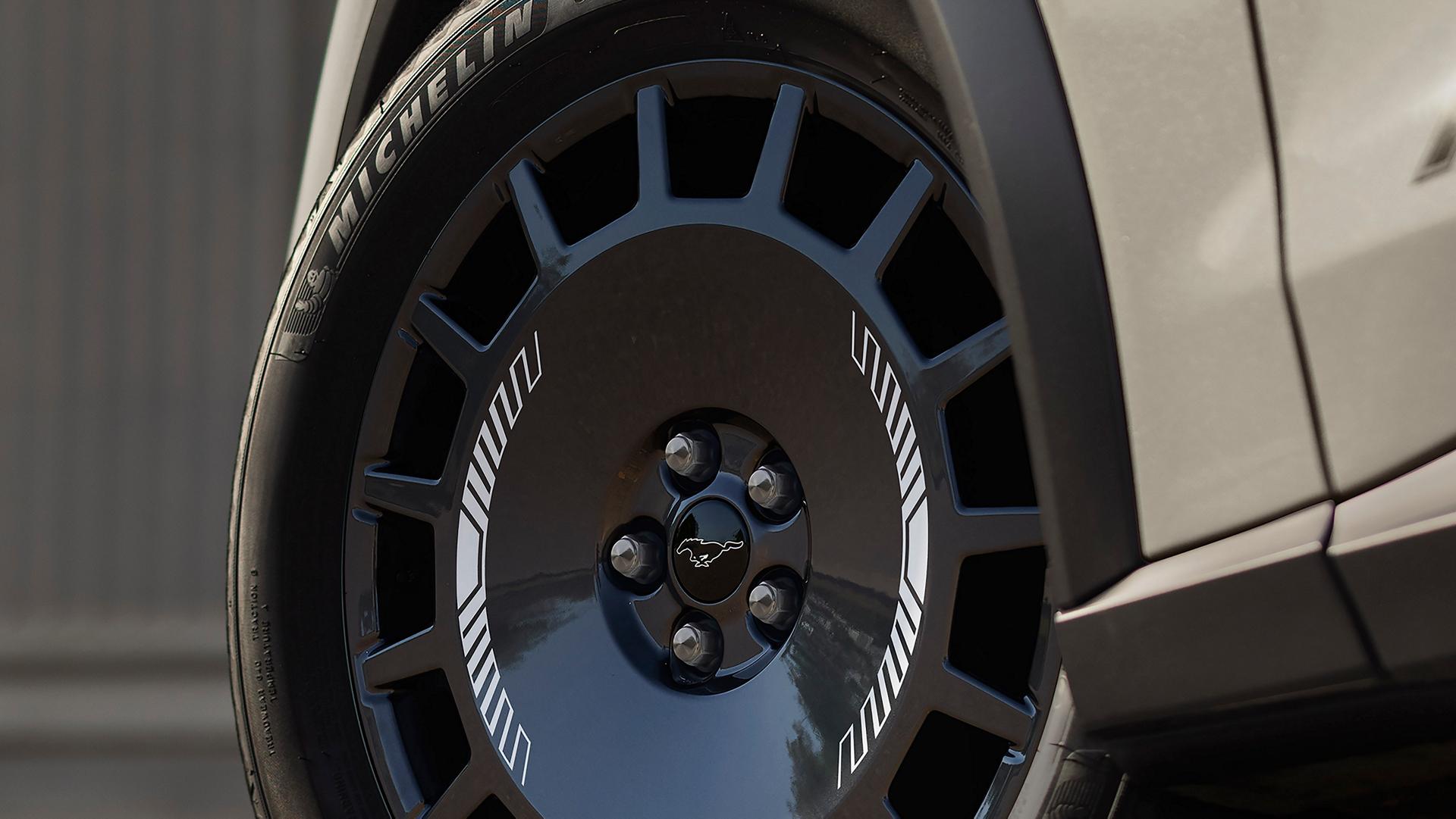 19" Dark Carbonized Grey wheels with Michelin® CrossClimate®2 performance tires on the 2025 Ford Mustang Mach-E® Rally model