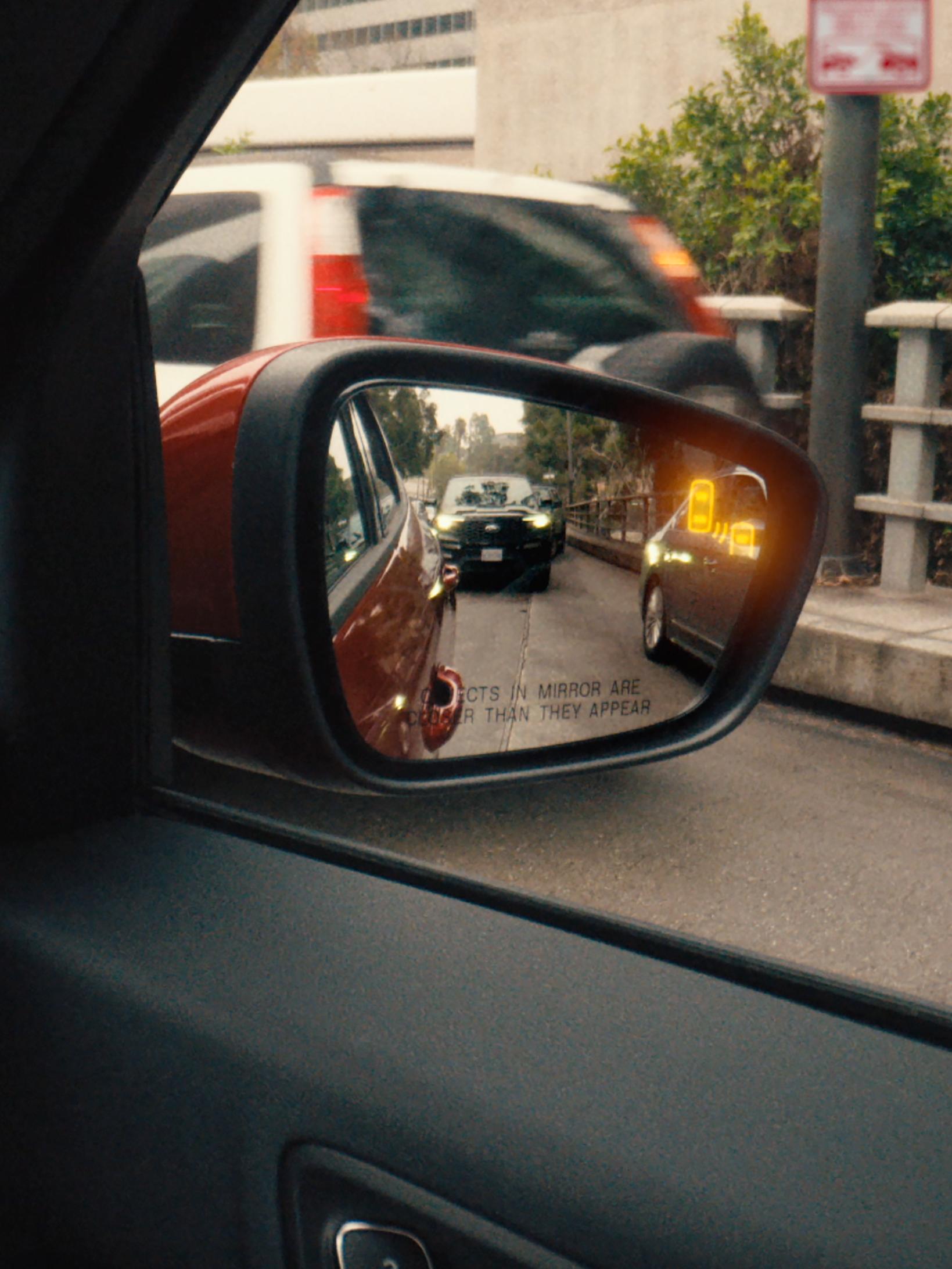 Blind Spot Information System (BLIS®) being activated on the side view mirror of a 2025 Ford Escape® SUV