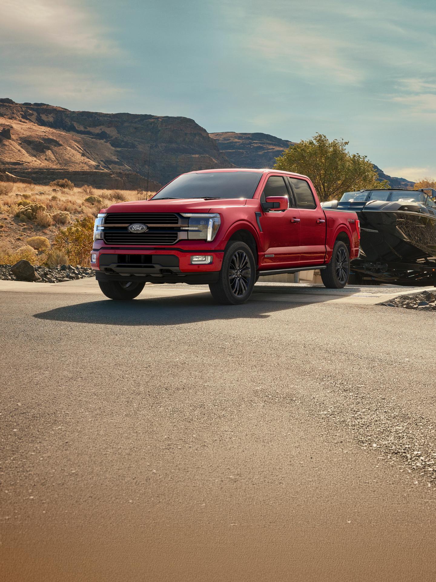 F-150 with a hitched boat parked at a dock. 