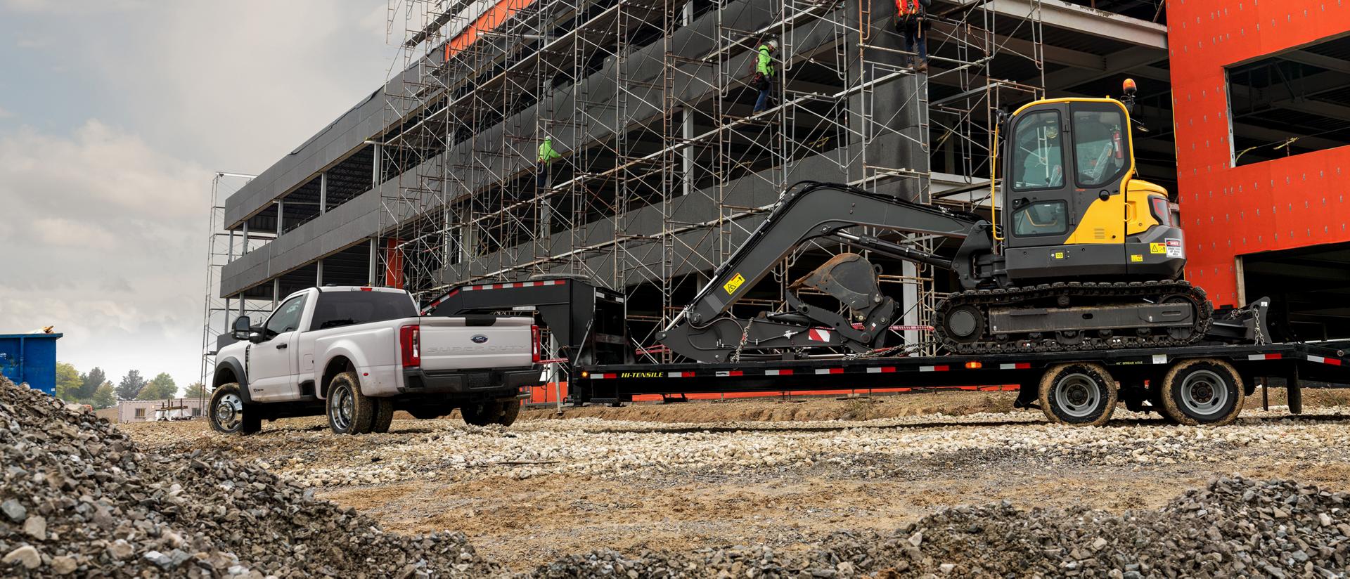 2026 Super Duty® F-450® XL model pulling a large trailer with a heavy tractor