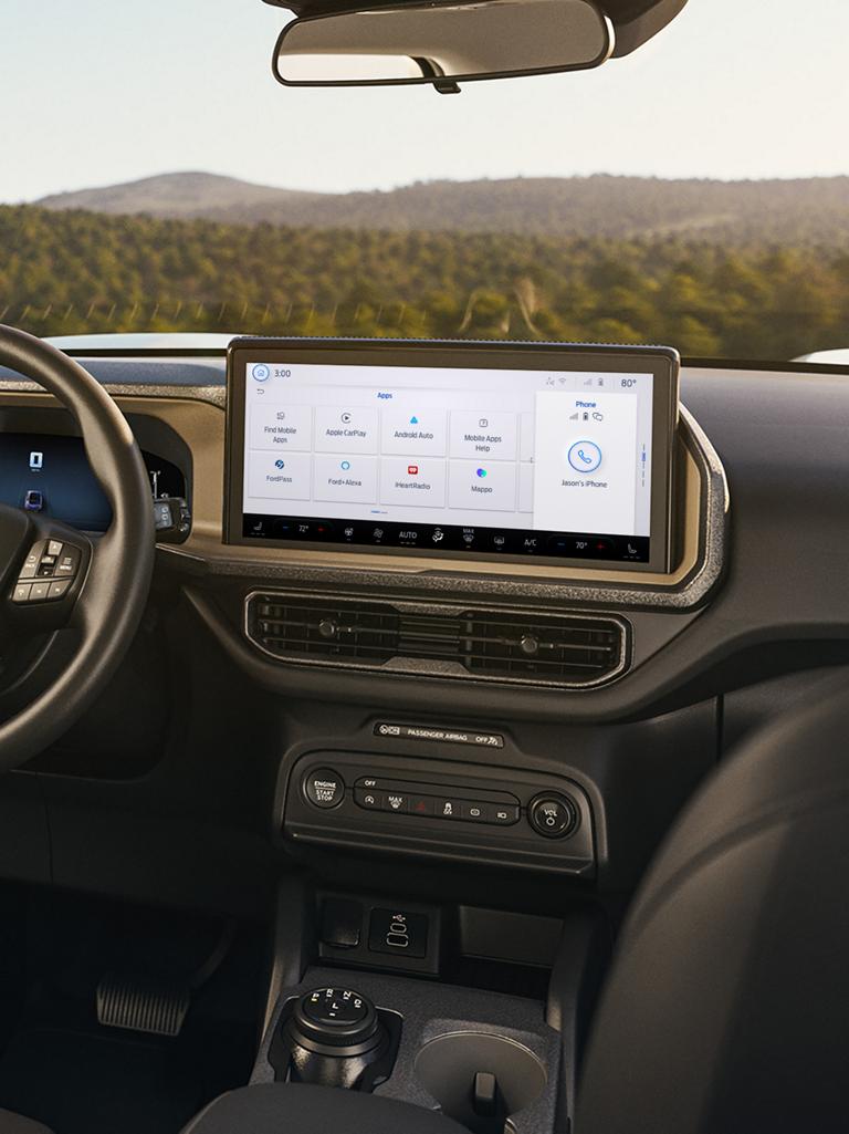 Interior of vehicle shown, highlighting the screen in the centre console