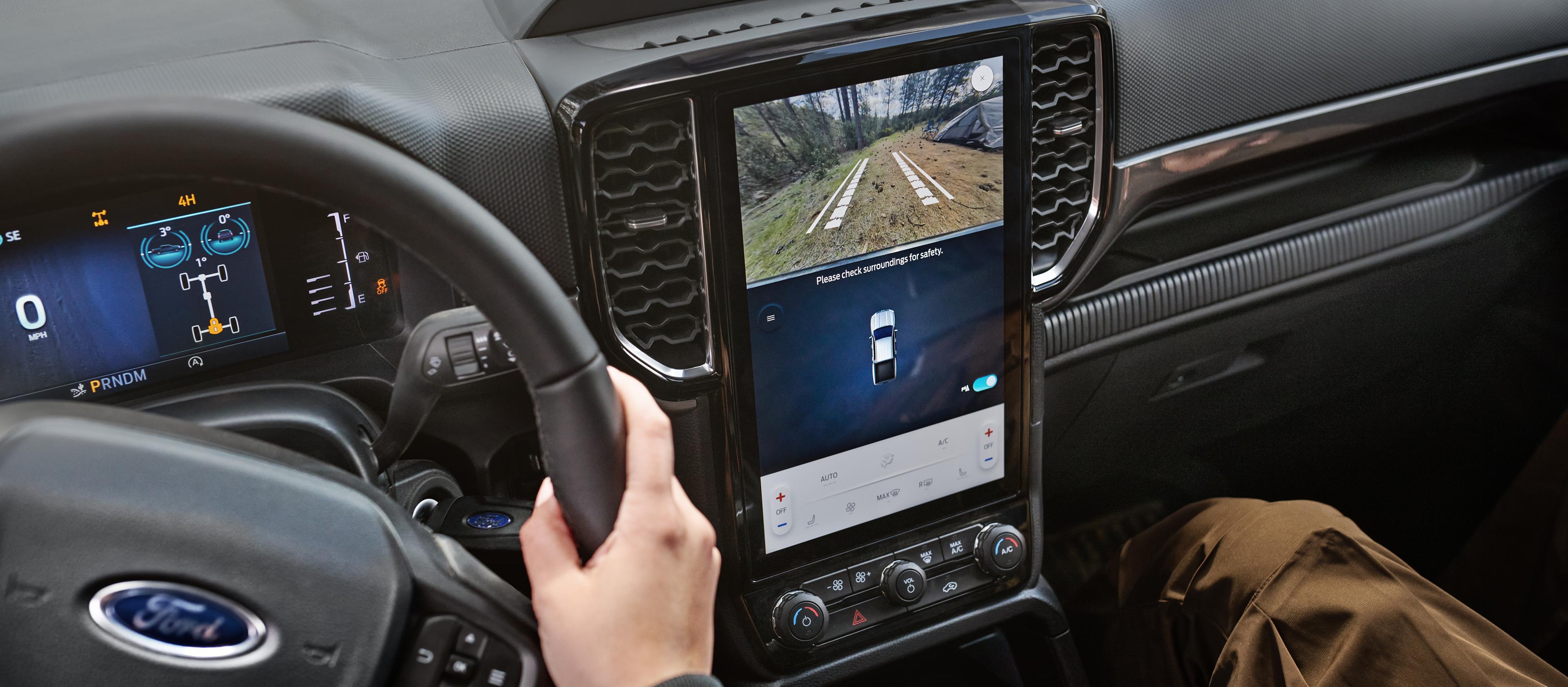 Interior view of the 2026 Ford Ranger® XLT model highlighting the centre display, cluster display, and steering wheel