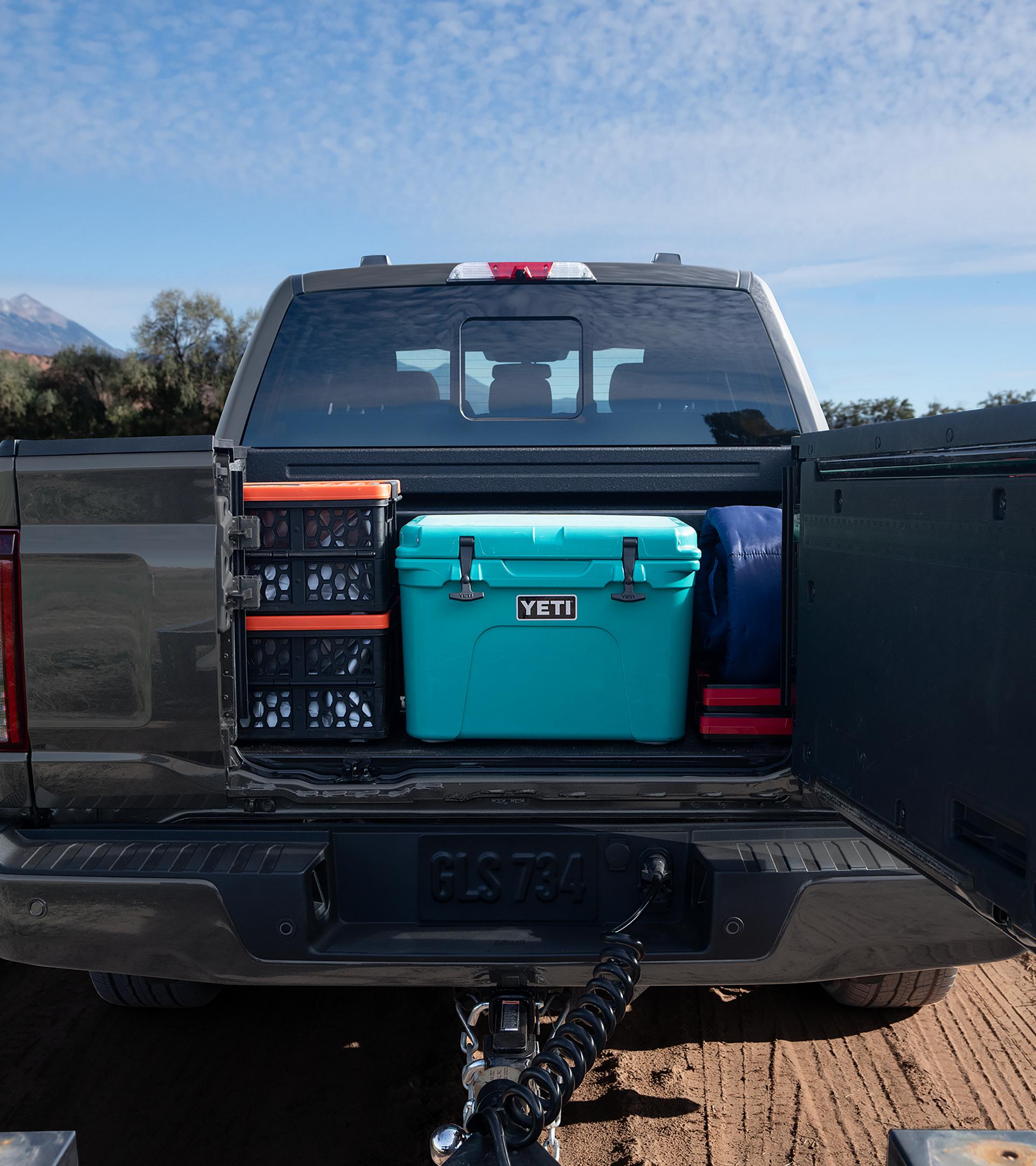 2026 Ford F-150® Platinum® pickup in Agate Black Metallic highlighting the Pro Access Tailgate