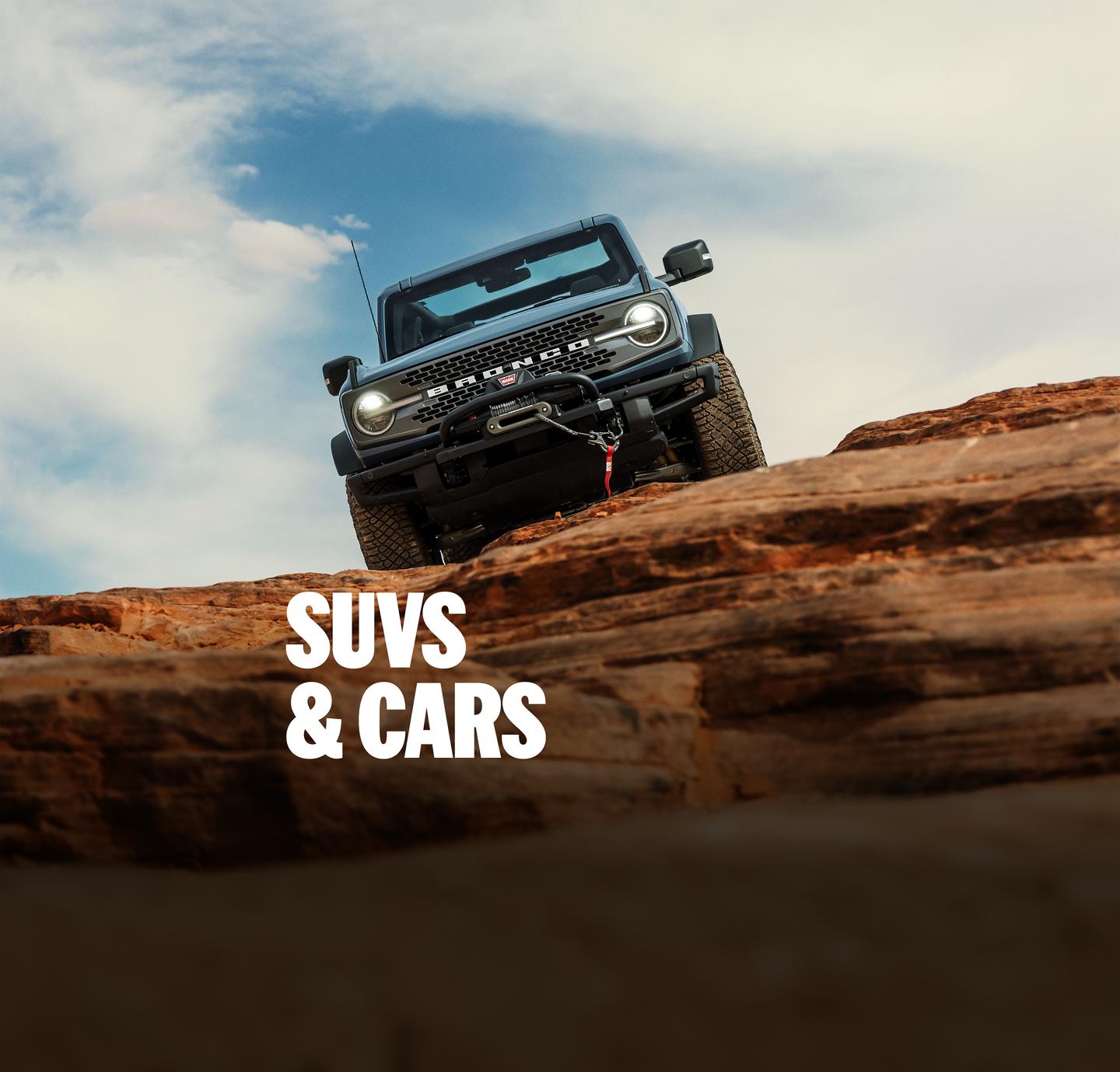 Ford SUVs driving through outdoor trails. "SUVs and Cars"