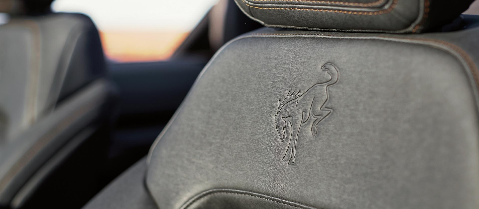 The embossed Bronco logo on the front seat of a 2026 Ford Bronco® SUV
