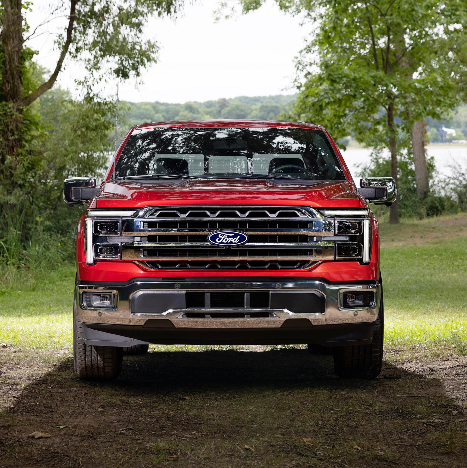 Front view of the grille on a 2027 Ford F-150® Lariat® model parked in a wooded setting