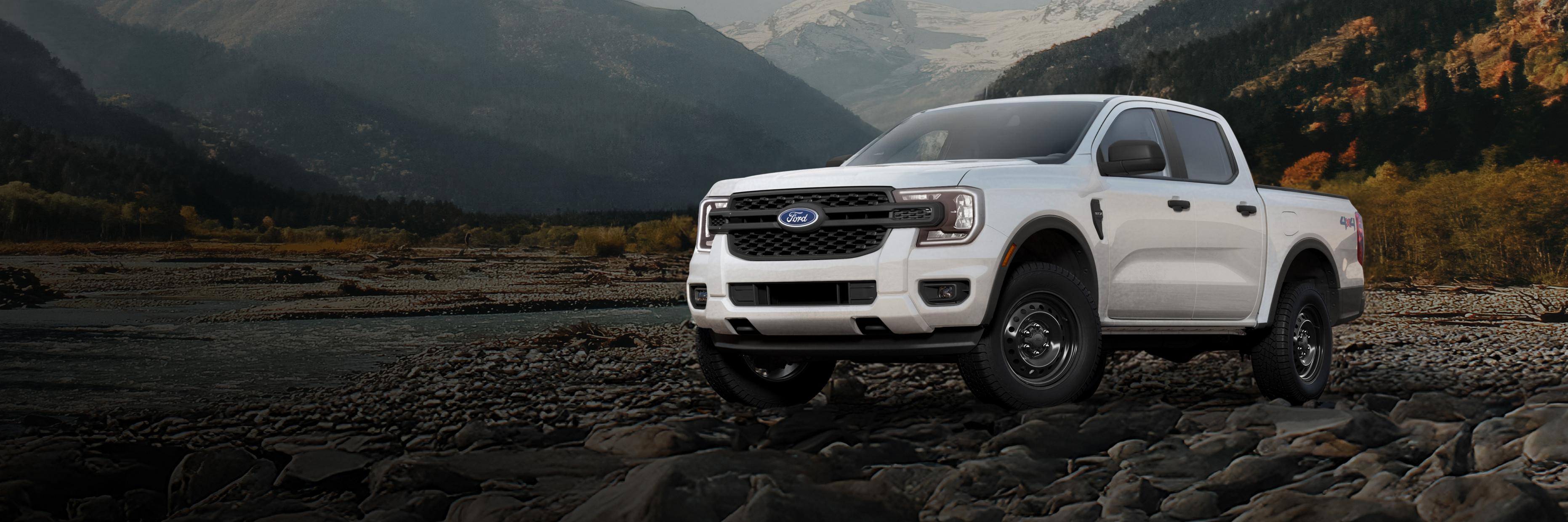 A 2026 Ford Ranger® XL model parked on a rocky river bank in the mountains