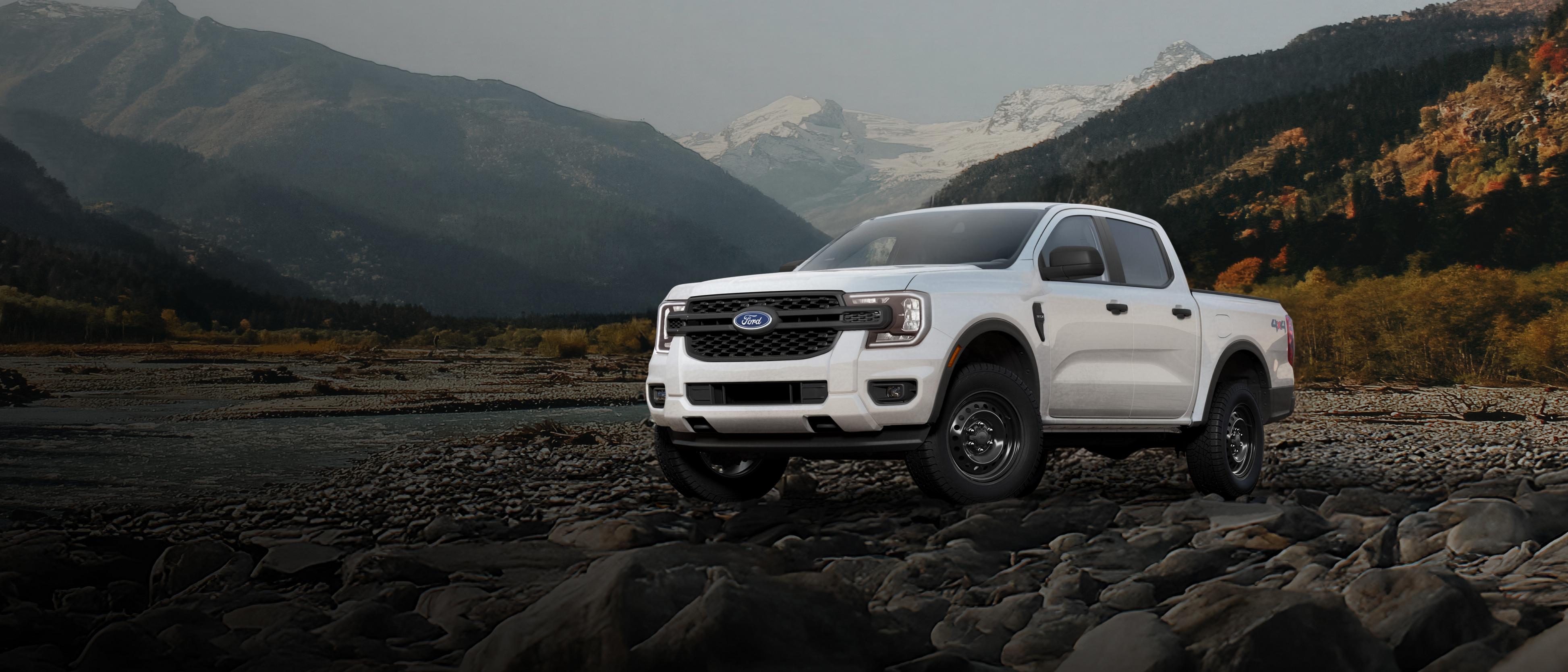 A 2026 Ford Ranger® XL model parked on a rocky river bank in the mountains