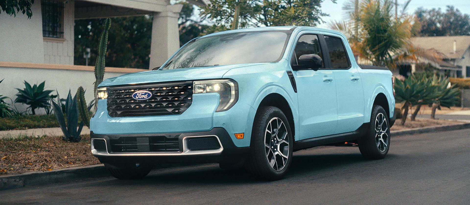 2026 Ford Maverick® pickup in Light Blue parked on the street in front of a home