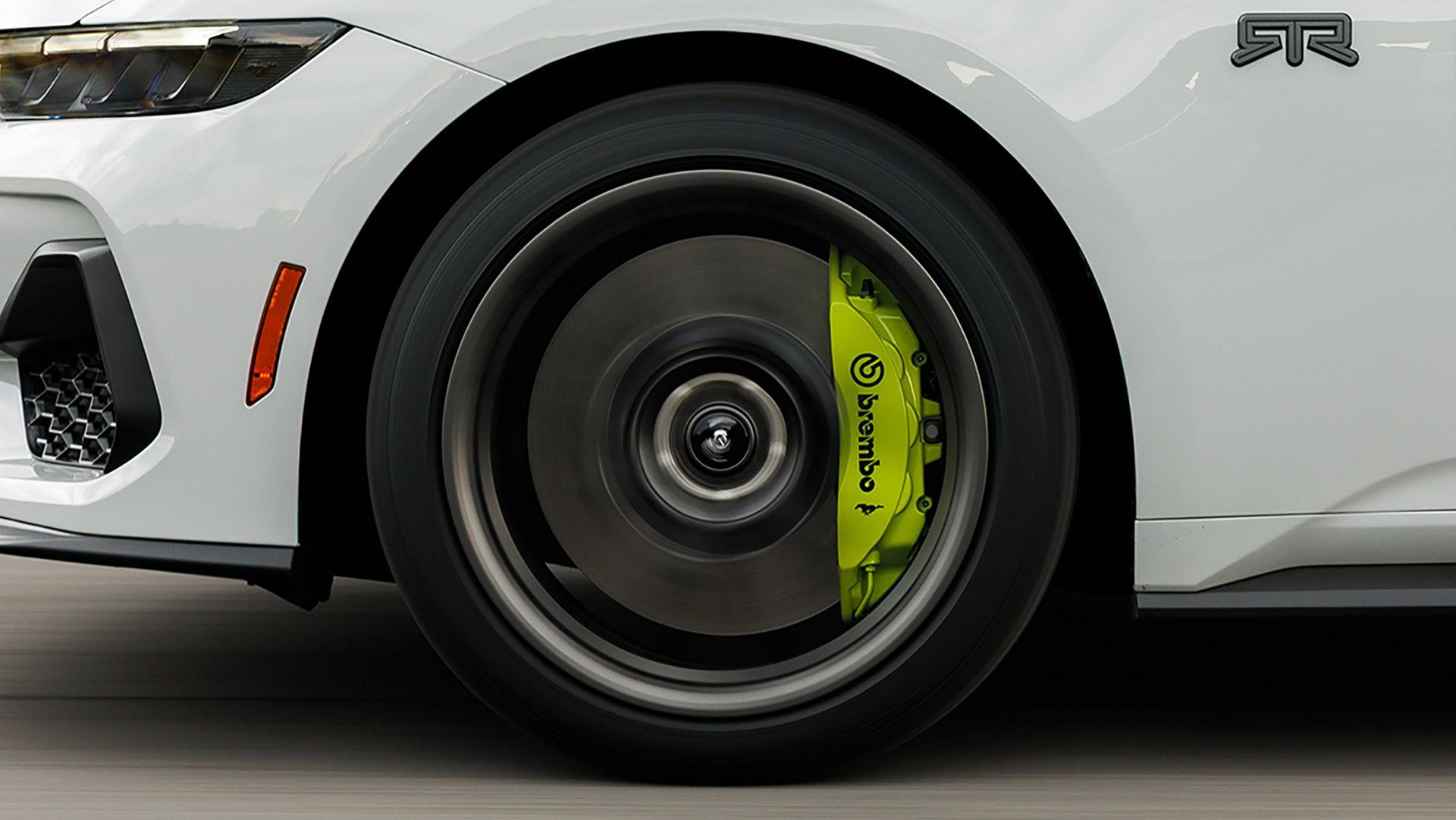 Parked 2026 Ford Mustang® EcoBoost® fastback with available Mustang® RTR® Package and Hyper Lime Brembo™ brake calipers