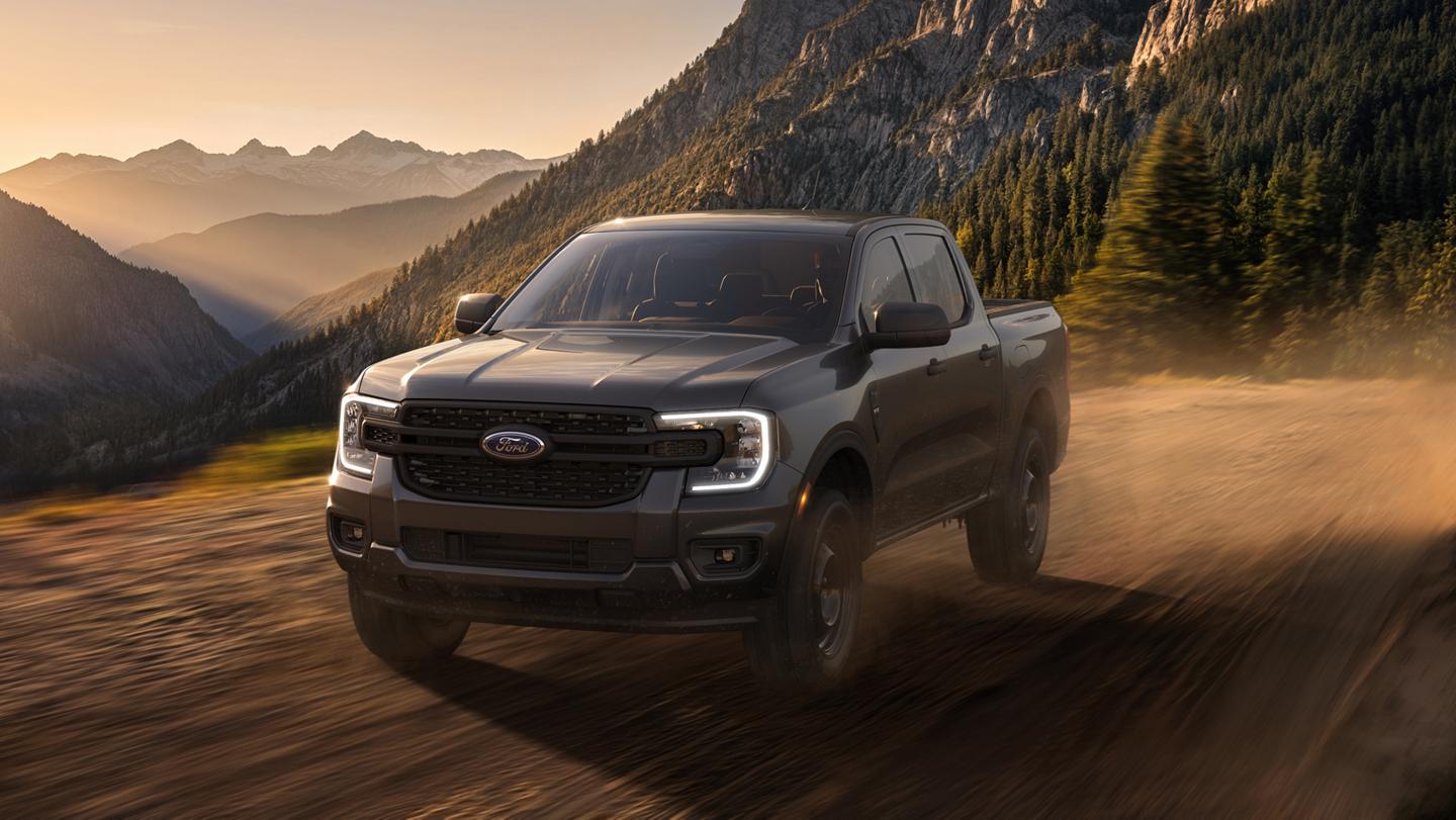 2026 Ford Ranger® XL model with the STX® Appearance Package being driven in the mountains at dusk