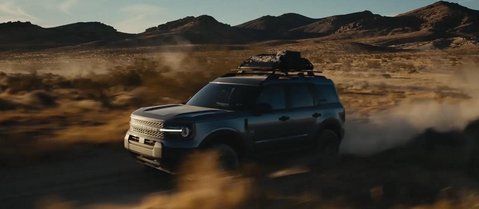 A 2026 Ford Bronco Sport® SUV being driven across a dusty desert field