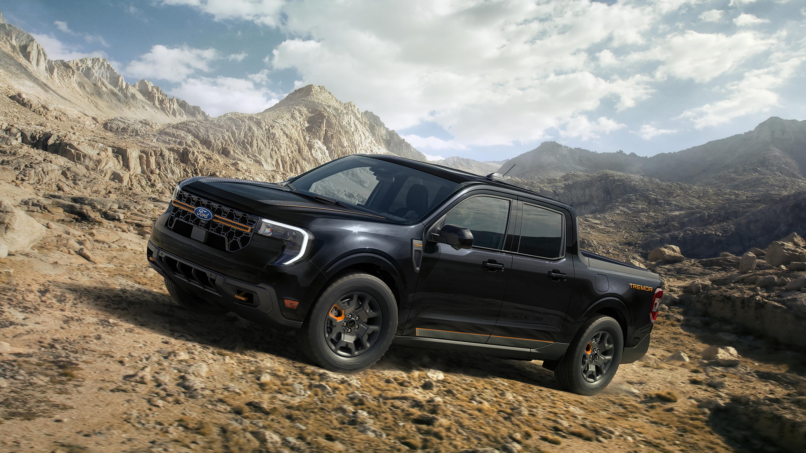 A 2026 Ford Maverick® Tremor® model being driven up a rocky hillside