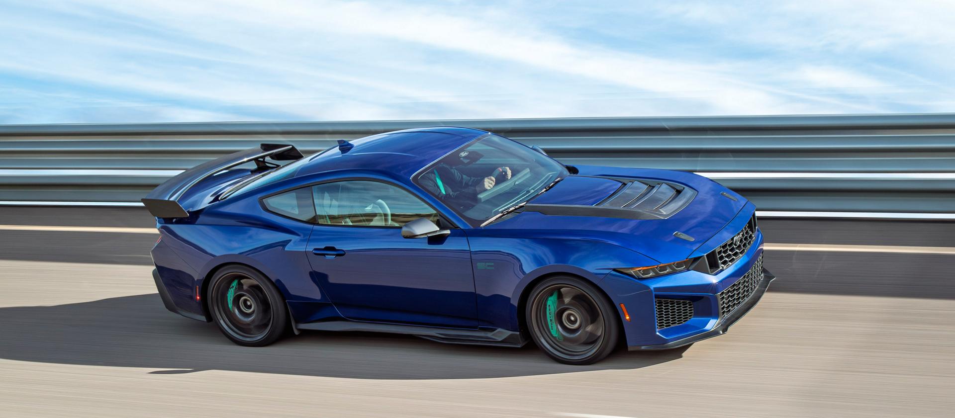 A 2026 Ford Mustang Dark Horse® SC with Track Pack and optional equipment driving on a closed track