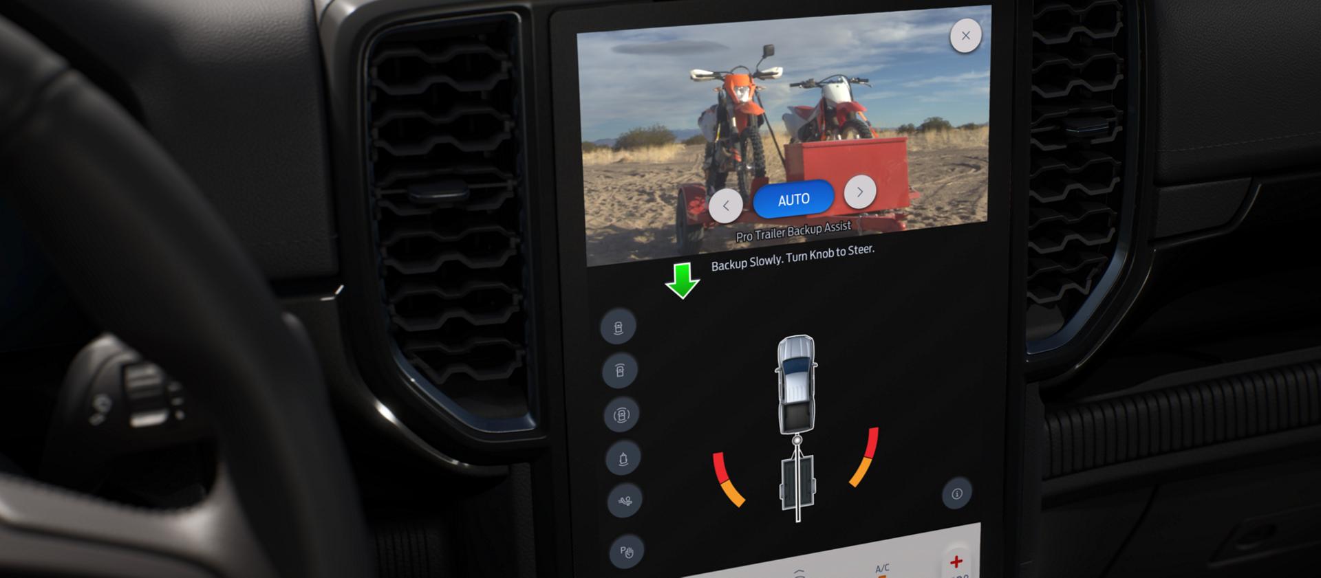 Interior photo showing 2025 Ford Ranger® rearview camera view and towing instructions