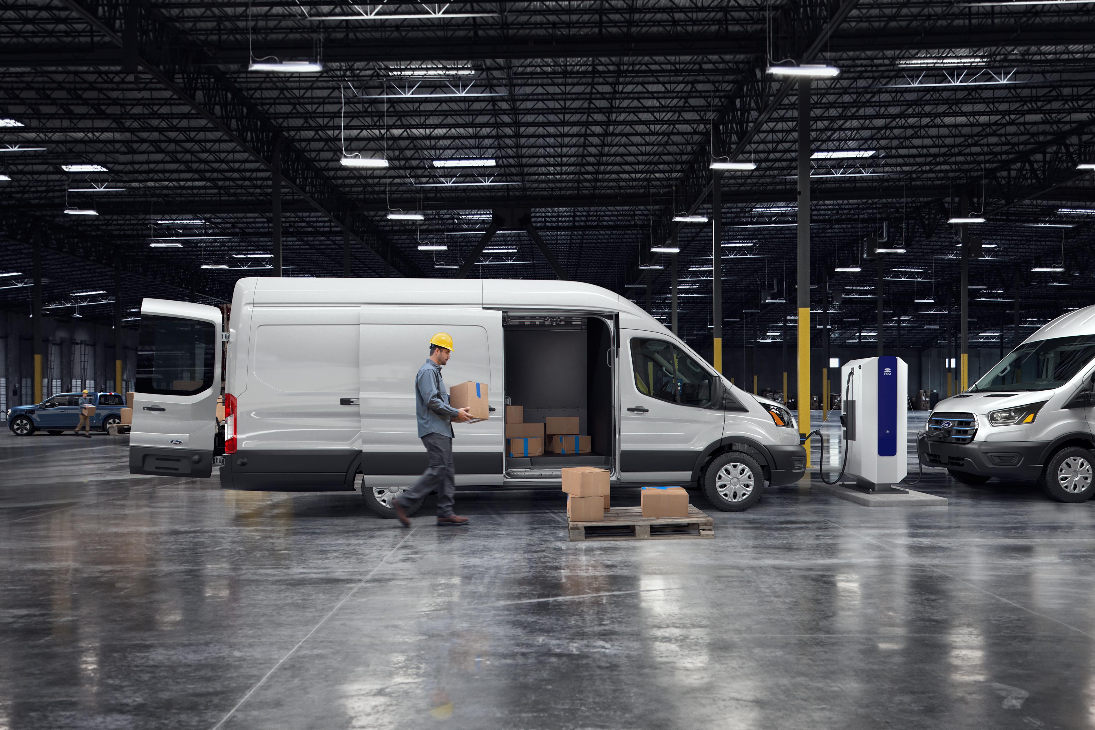 A white 2025 Ford E-Transit™ van parked in a warehouse