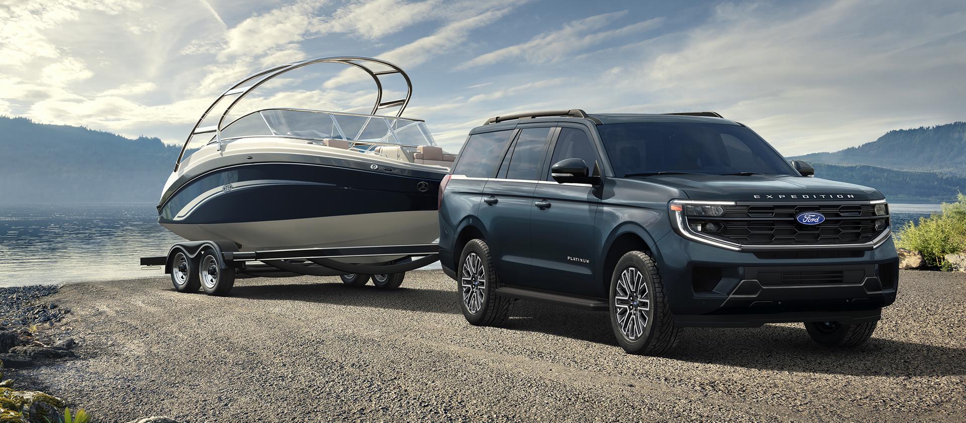 2027 Ford Expedition® Platinum™ SUV with a driver towing a boat on a trailer