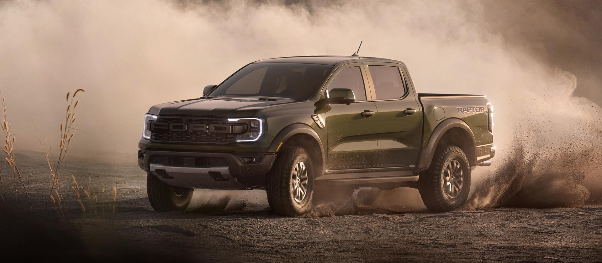 A 2025 Ford Ranger® Raptor® pickup is being driven off kicking up dust