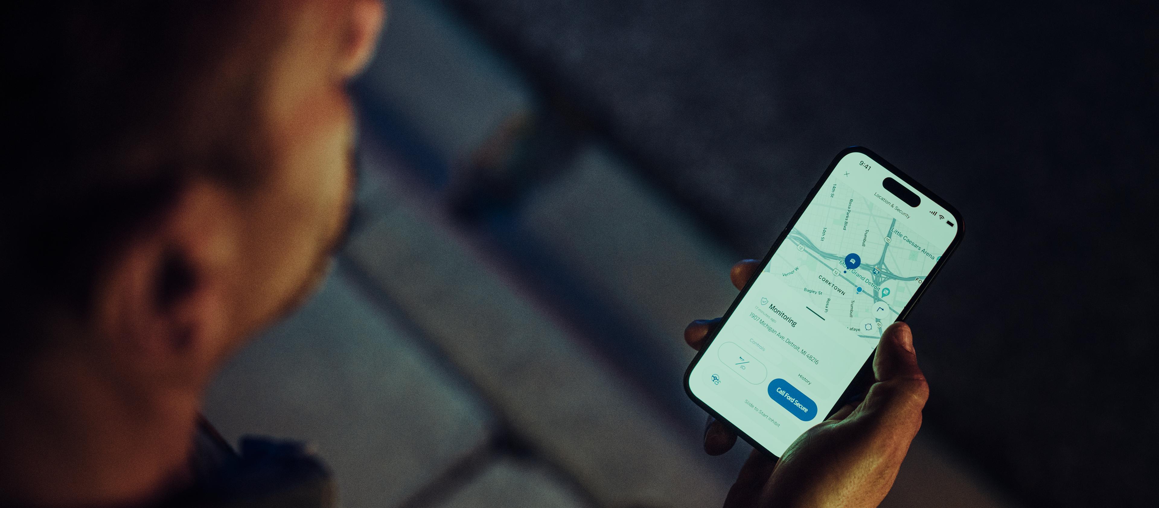 Person getting Ford Security Package alerts on a mobile phone