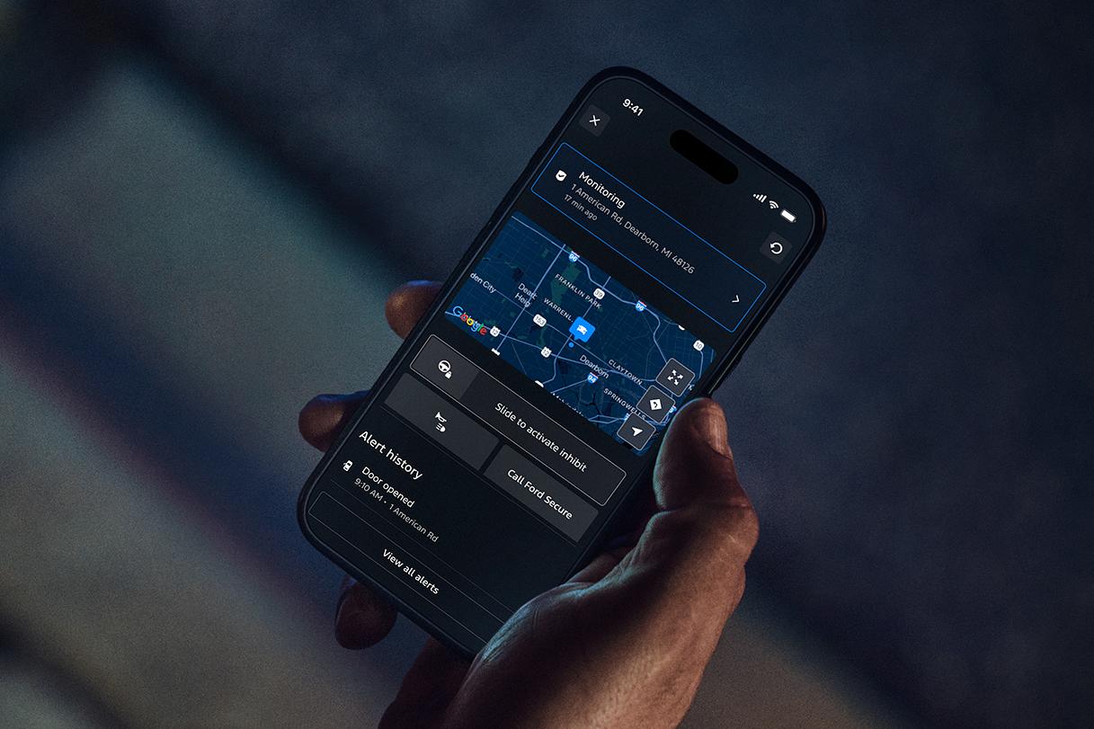Person getting Ford Security Package alerts on a mobile phone.