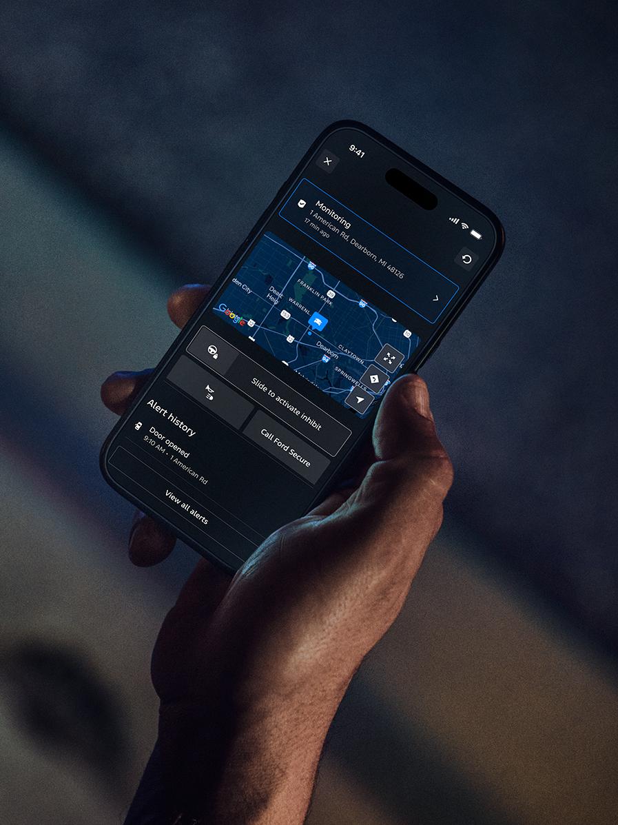 Person getting Ford Security Package alerts on a mobile phone.