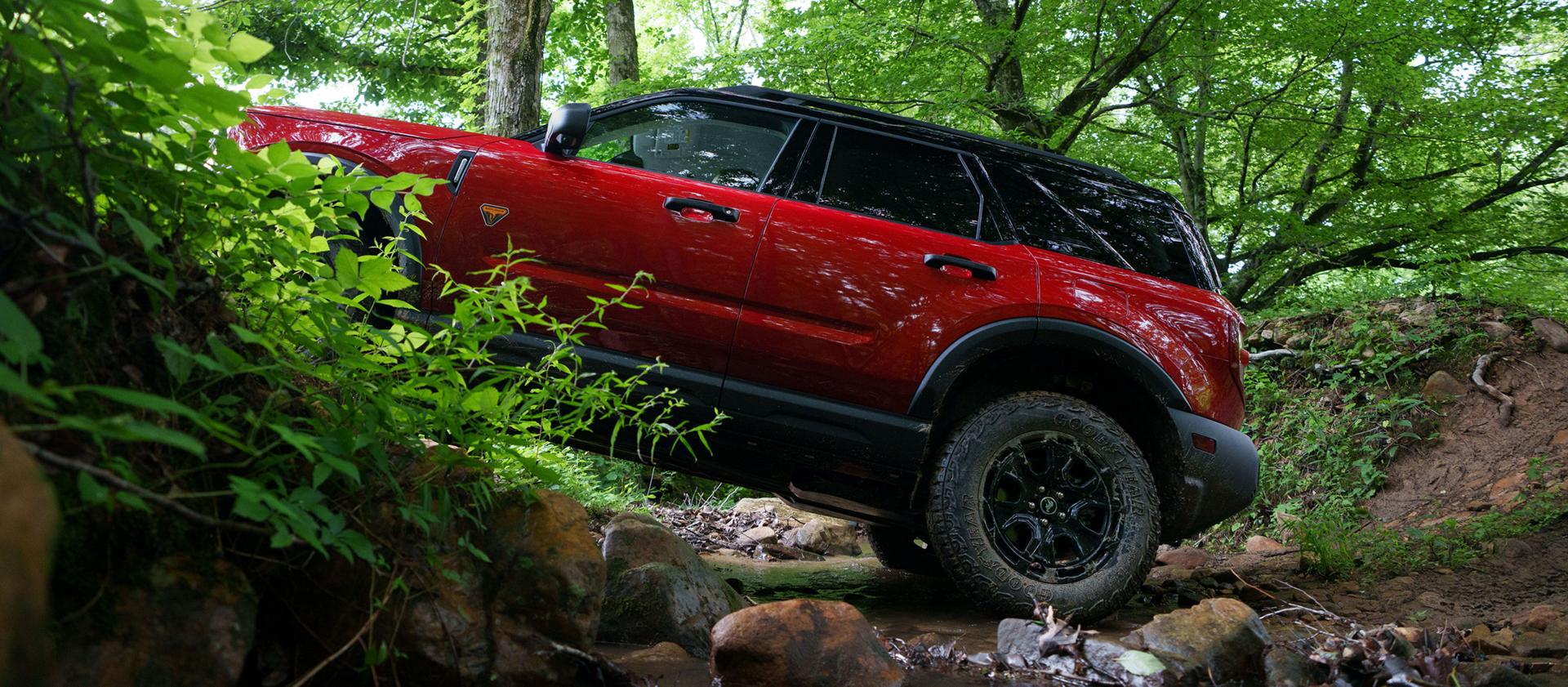 2026 Ford Bronco Sport® SUV with a Bronco Off-Roadeo®being driven up a rocky hill