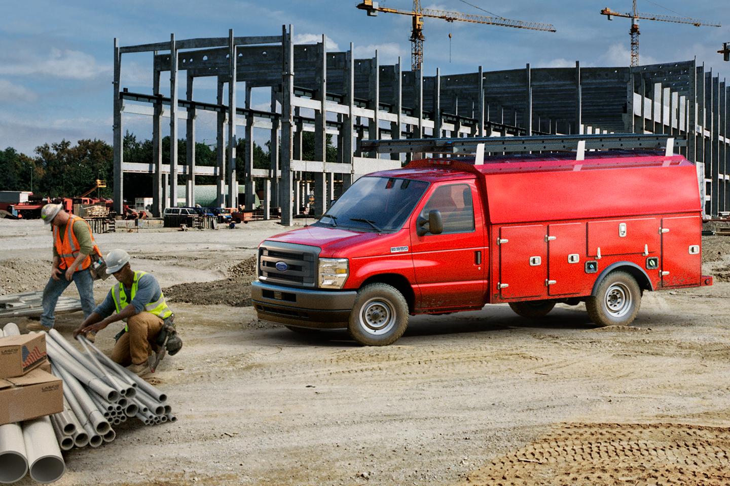 A red Ford E-Series Cutaway with a storage box upfit