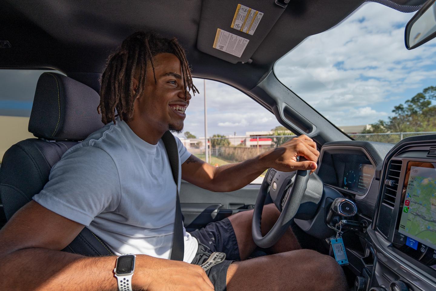Person driving a Ford vehicle.