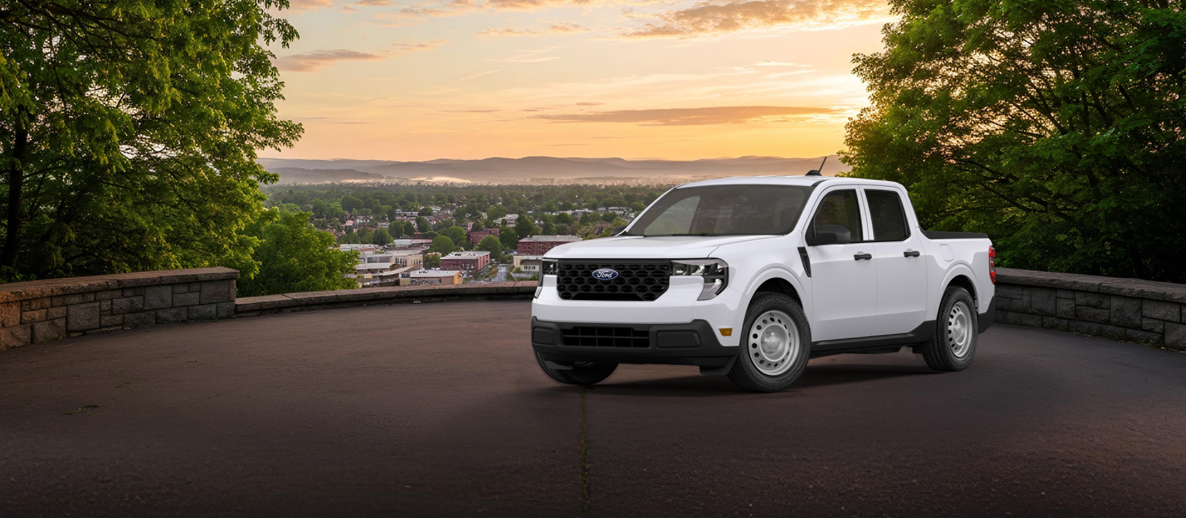 2026 Ford Maverick® pickup in Oxford White parked overlooking a city