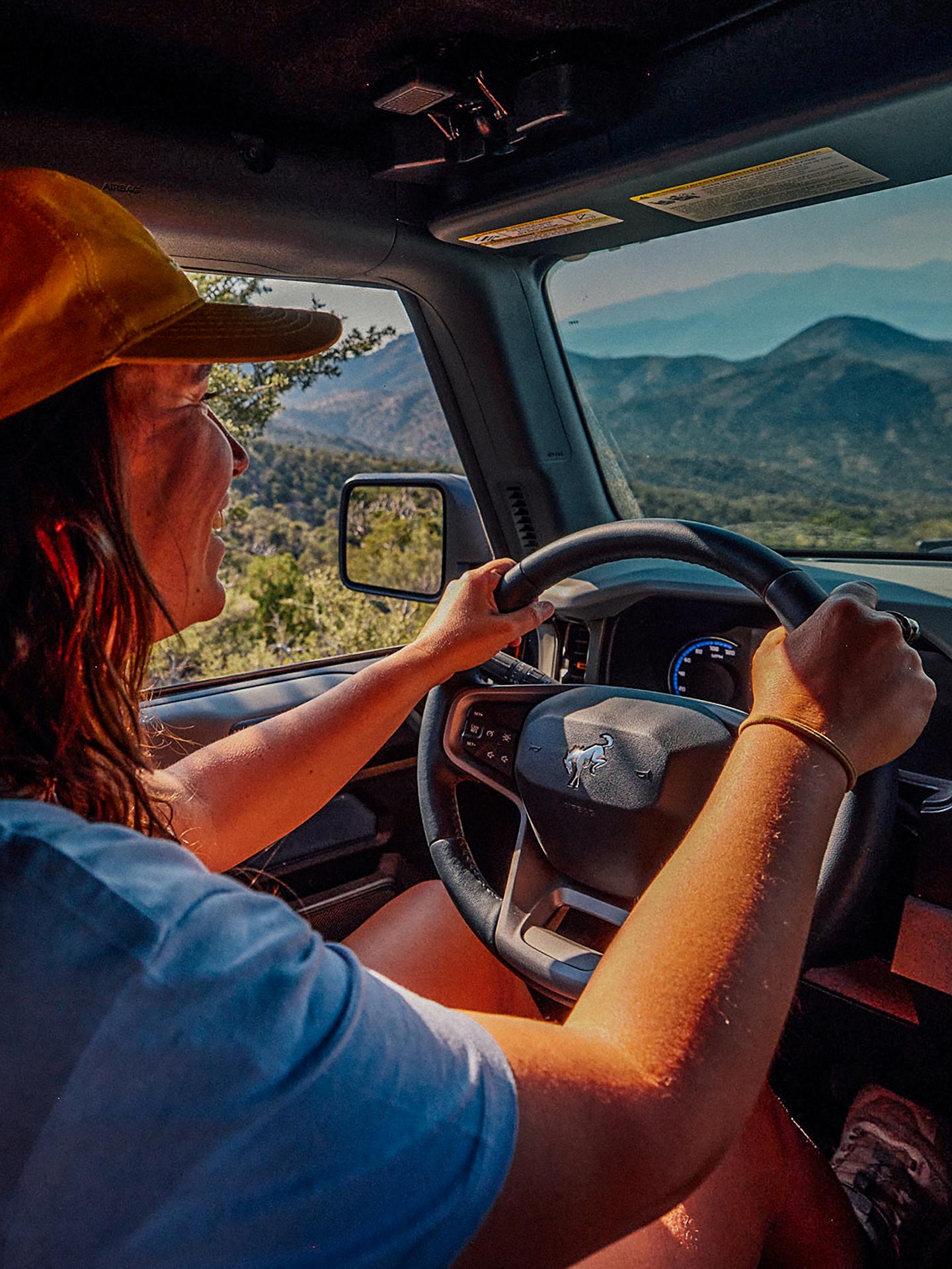 Person driving a Ford vehicle.