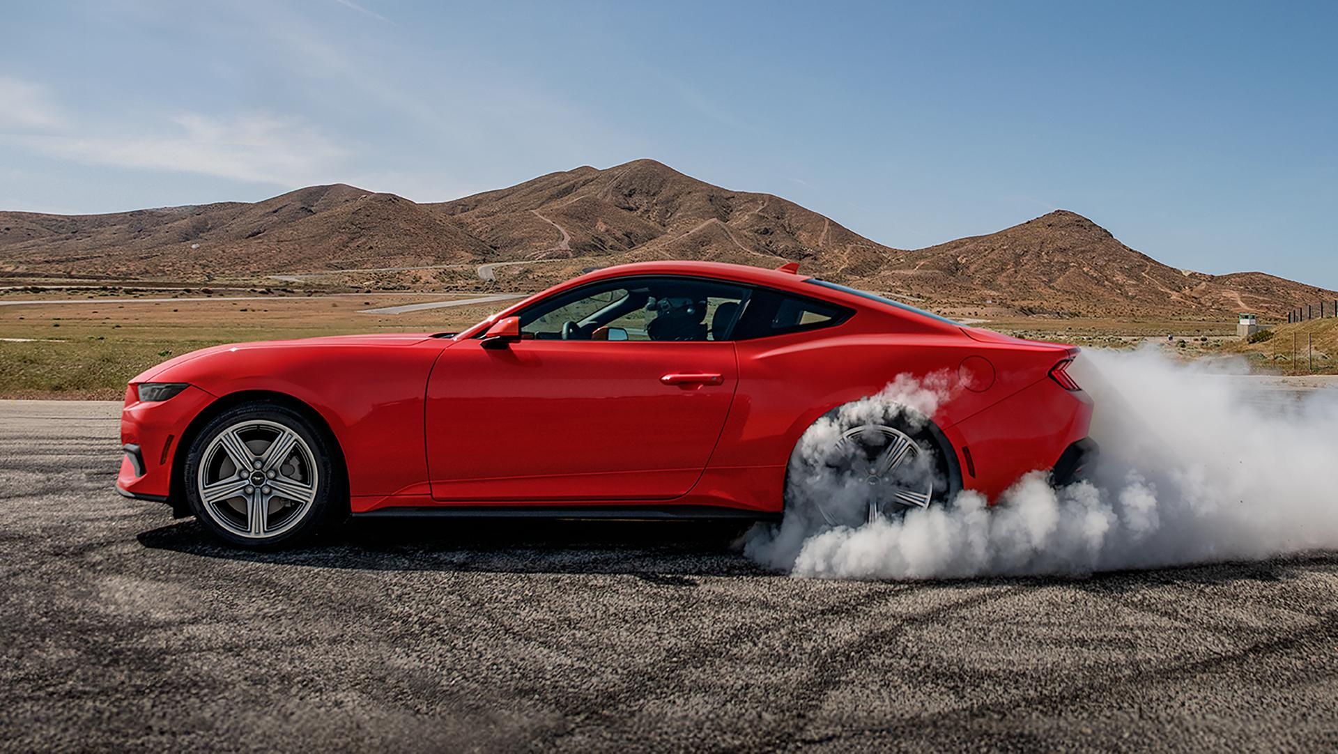 2026 Ford Mustang® EcoBoost® fastback with a driver doing burnouts on a closed course