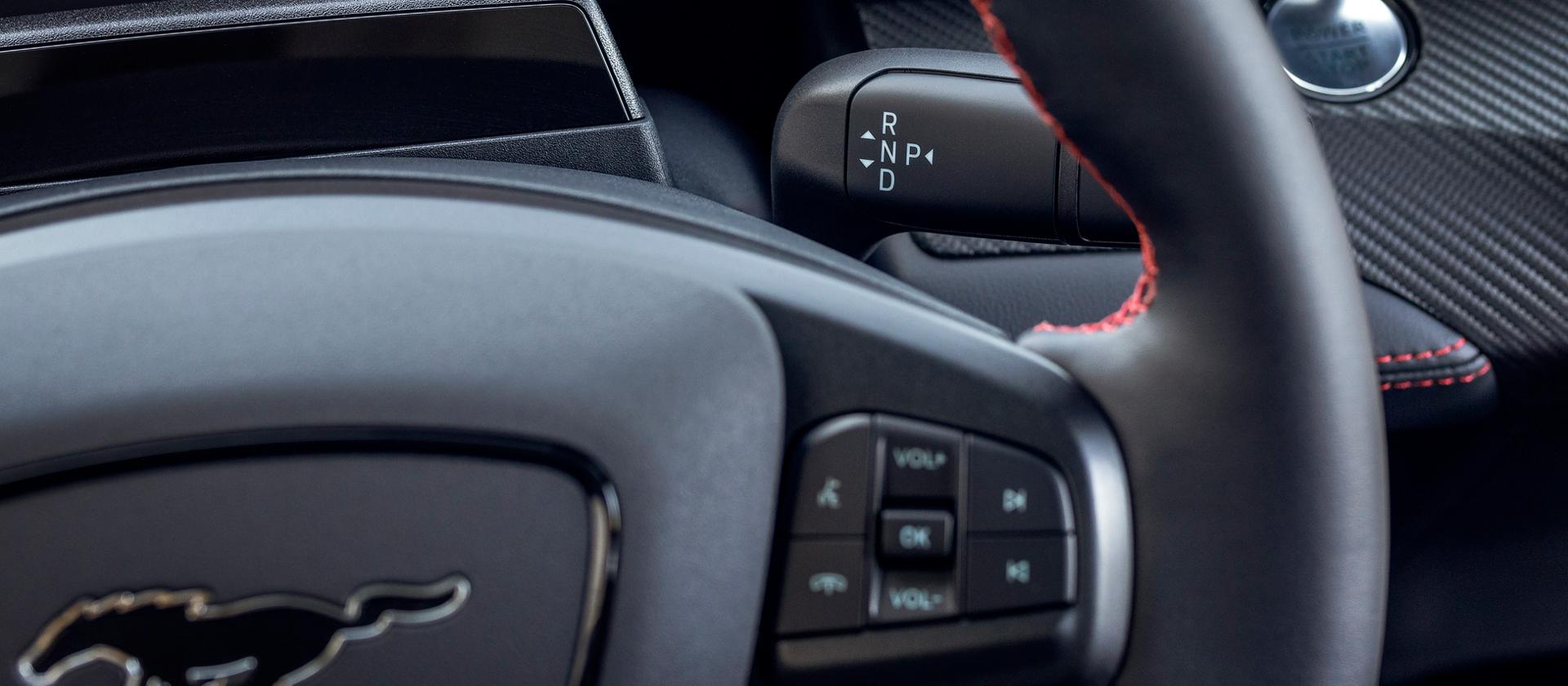 2025 Ford Mustang Mach-E® close-up of steering wheel showing audio controls