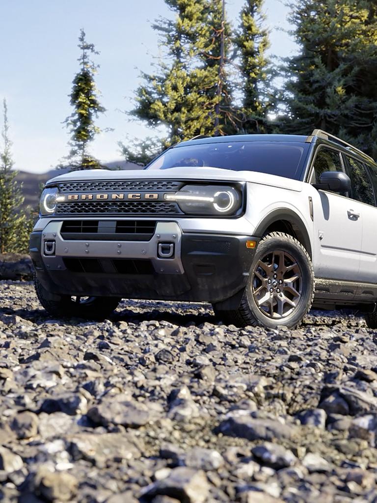 2026 Ford Bronco Sport® SUV parked in the woods surrounded by trees