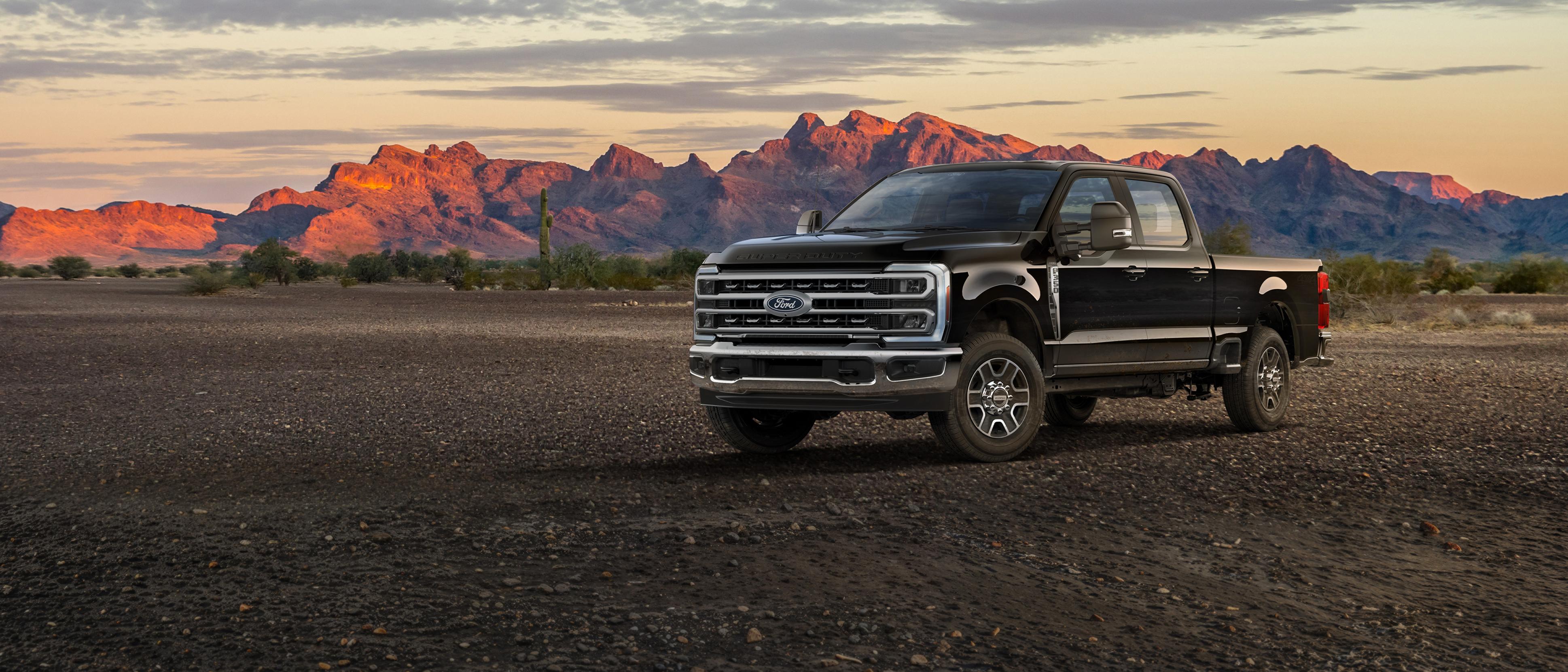 2027 Ford Super Duty® F-350® Lariat® truck parked on a dirt road in the mountains