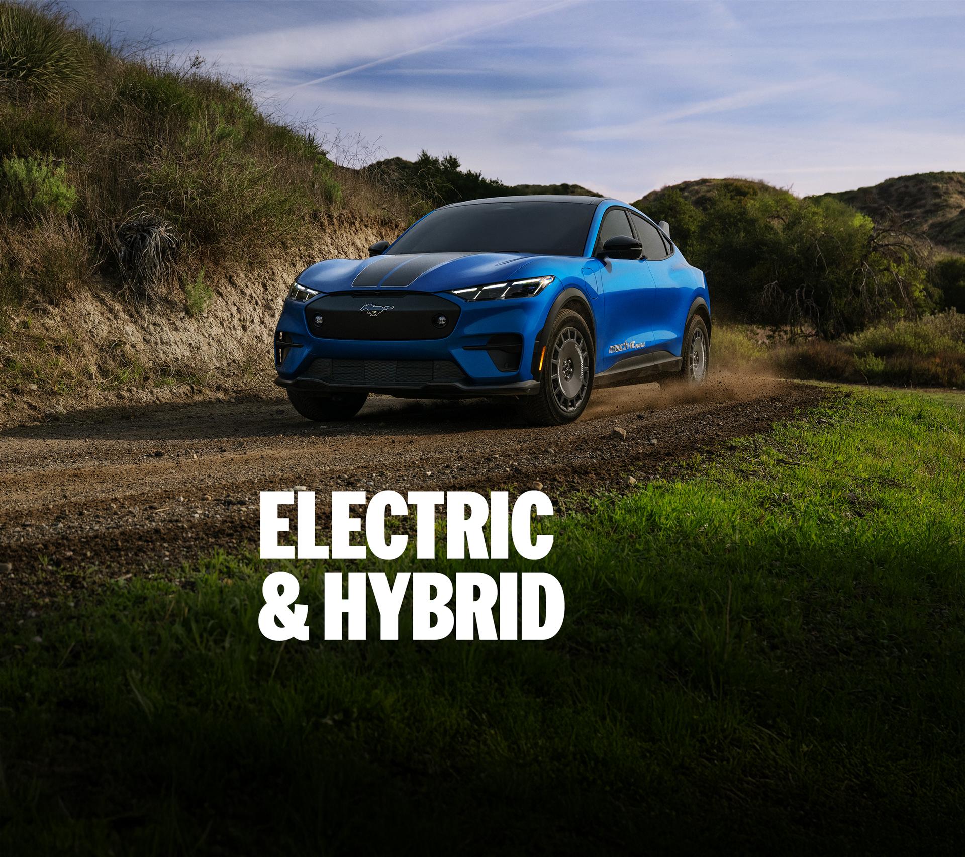 F-150 Lightning and Mustang Mach-E driving on a dirt trail. "Electric and Hybrid"