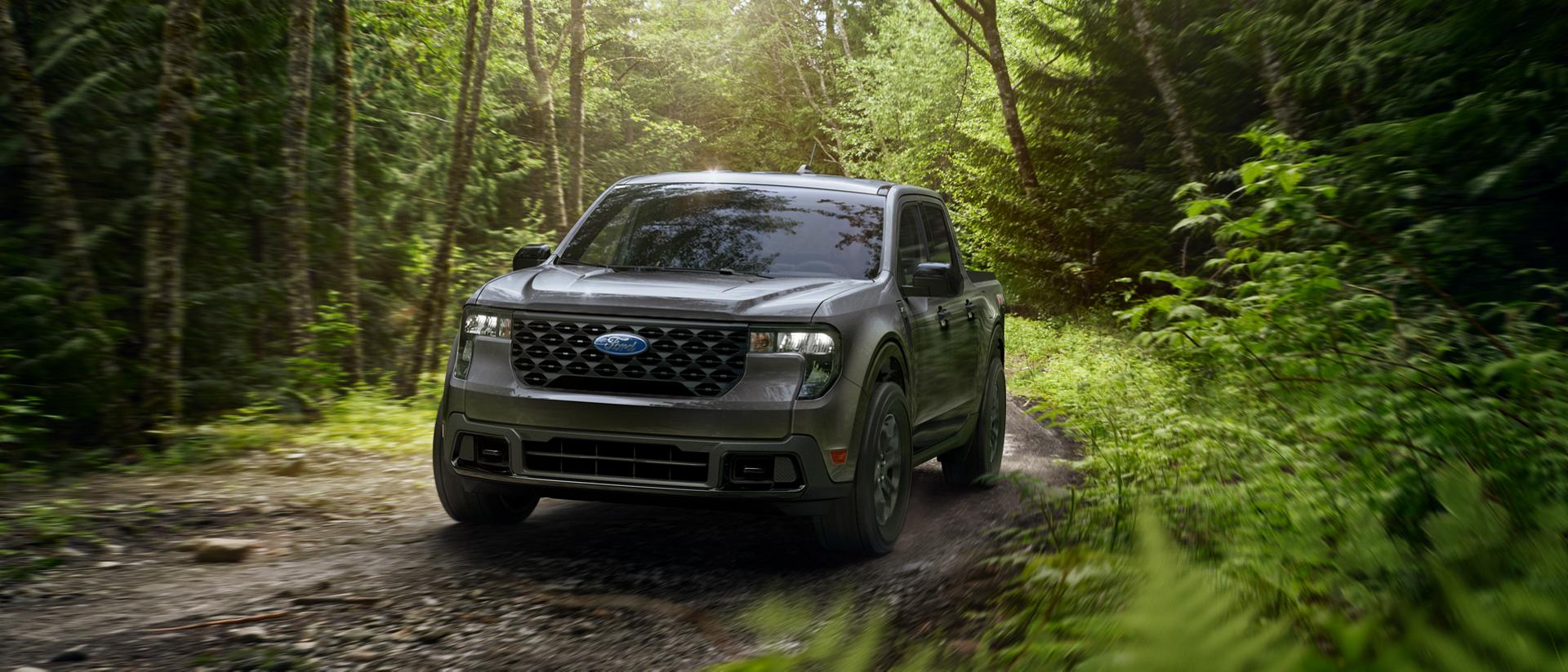 2026 Ford Maverick® pickup with the FX4® Off-Road Package model being driven through a forest