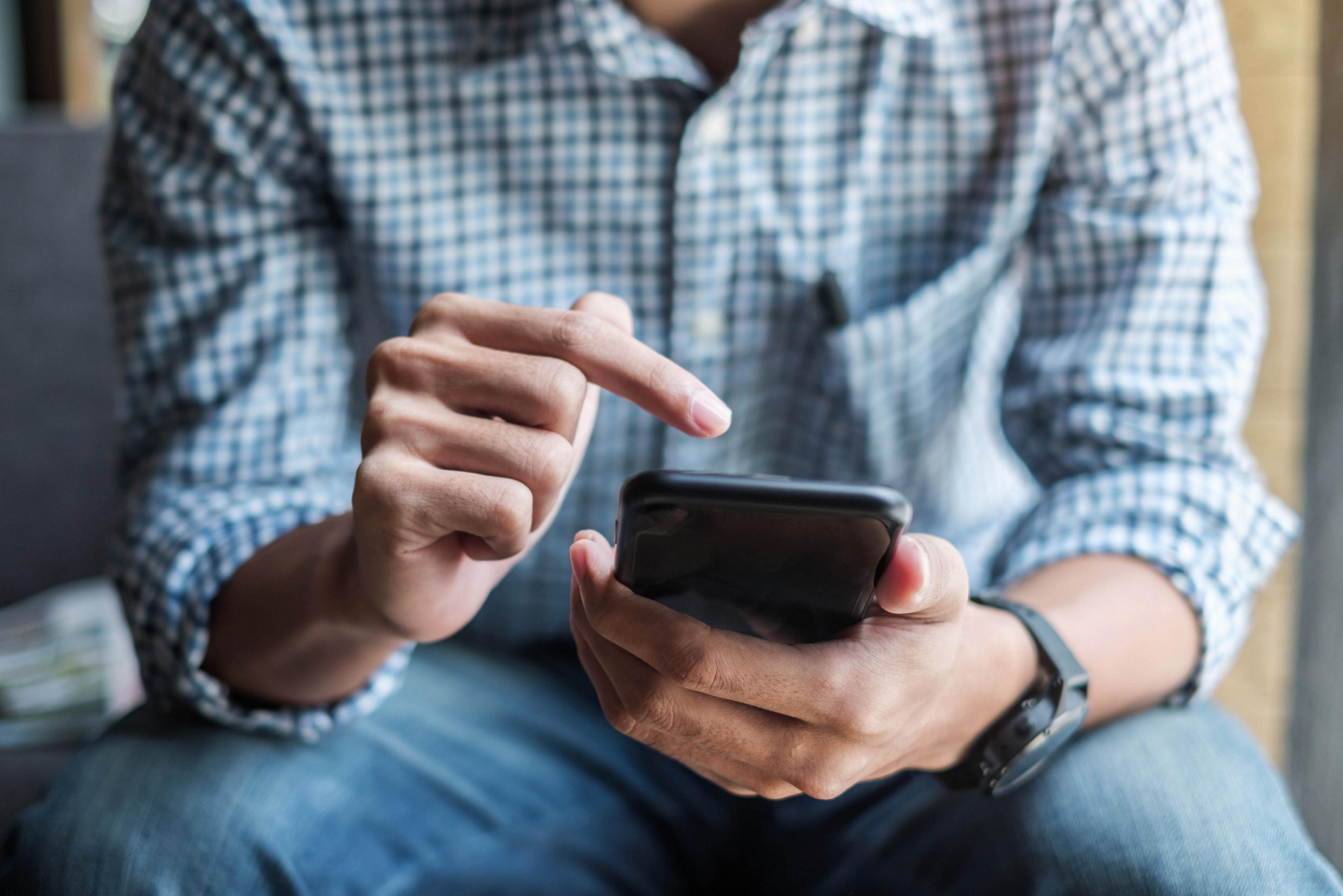 Person looking at a smartphone.