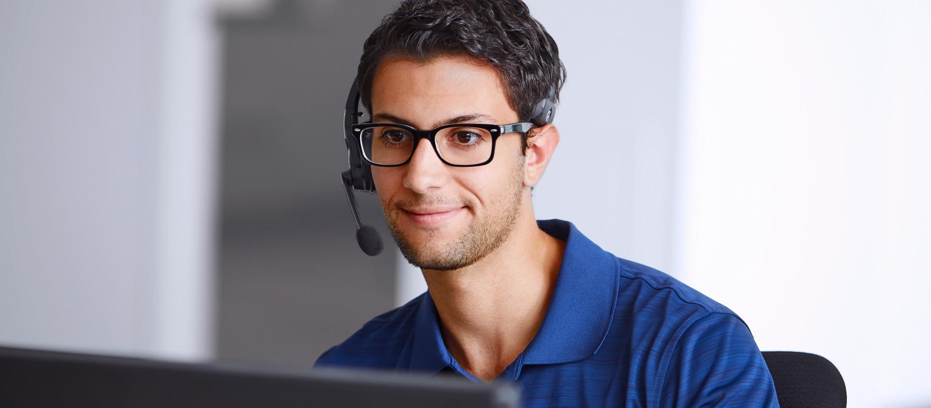 A Ford customer service agent wearing a headset.