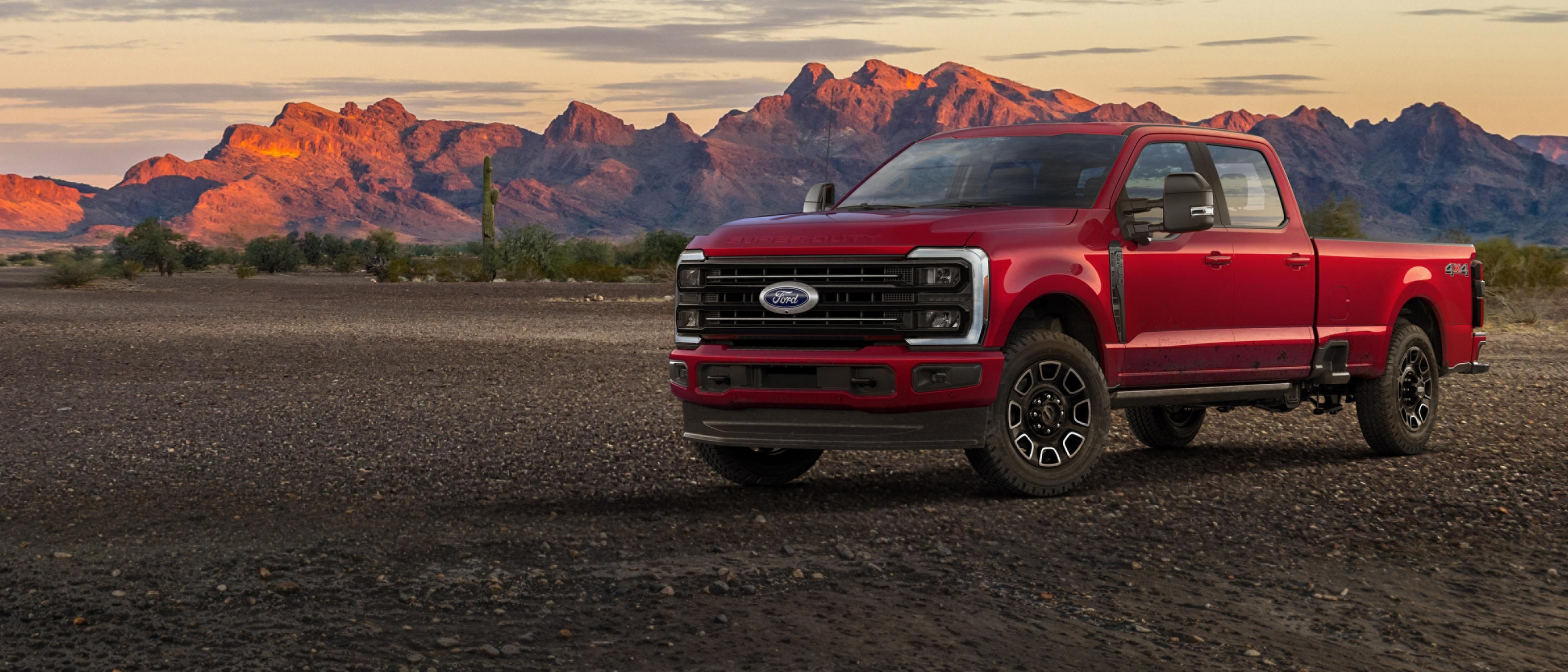 2026 Ford Super Duty® F-350® Platinum® model parked on gravel with mountains in the background