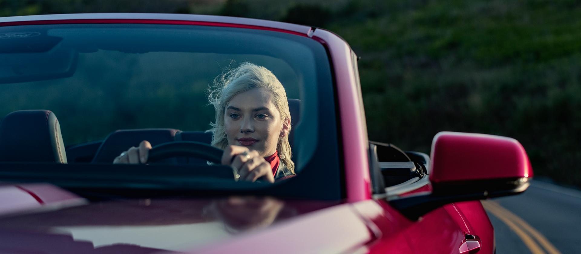 Person driving a 2026 Ford Mustang® GT convertible on a highway