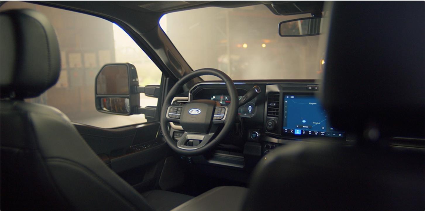 Interior of a 2026 Ford Super Duty showing the steering wheel and centre console touchscreen
