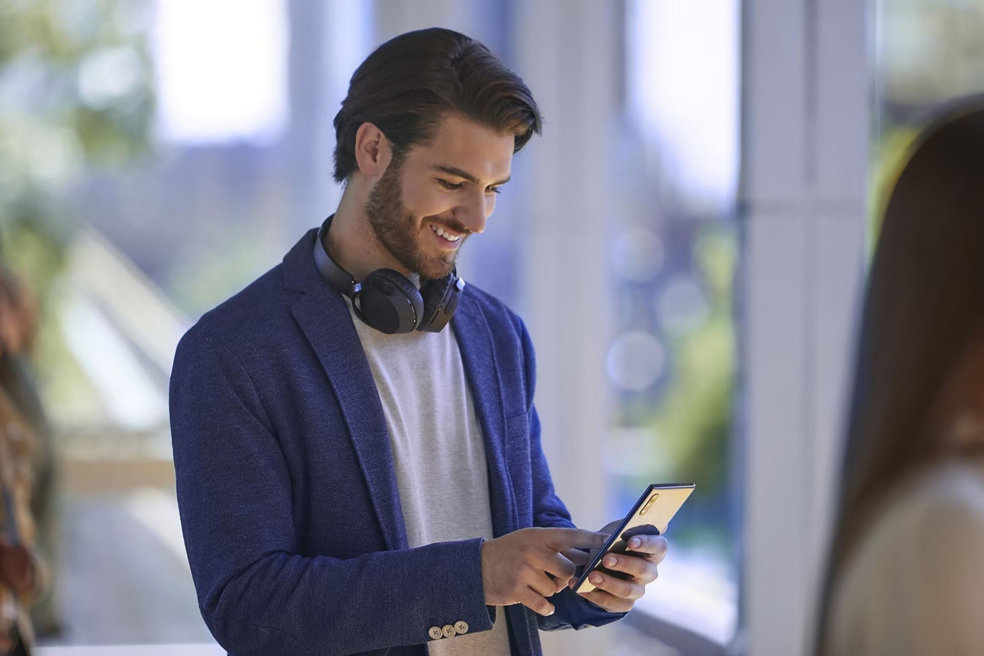 A Ford owner checks their Ford Rewards points on their phone.
