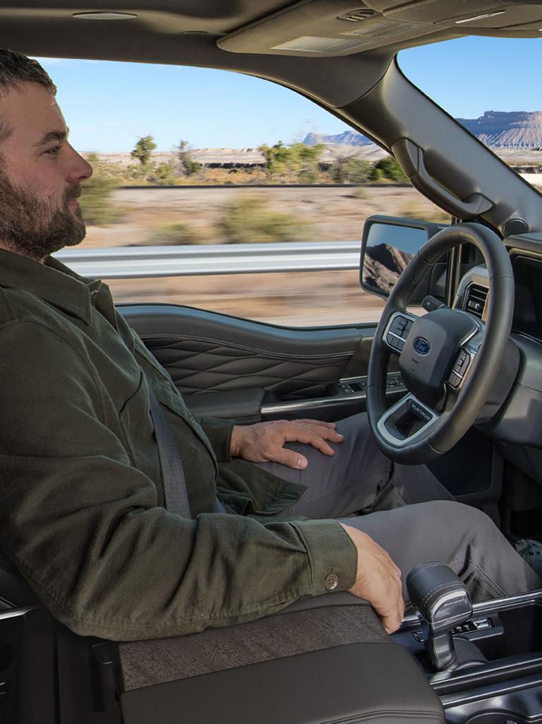 Man using the BlueCruise hands-free highway driving feature