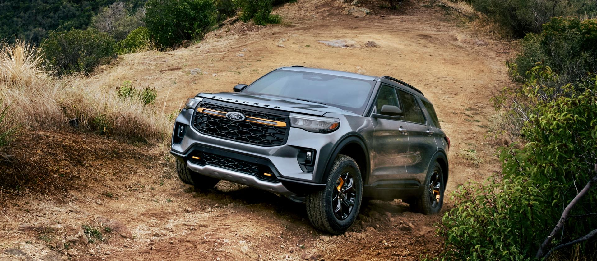 A 2026 Ford Explorer® Tremor® SUV being driven on a dusty mountain road