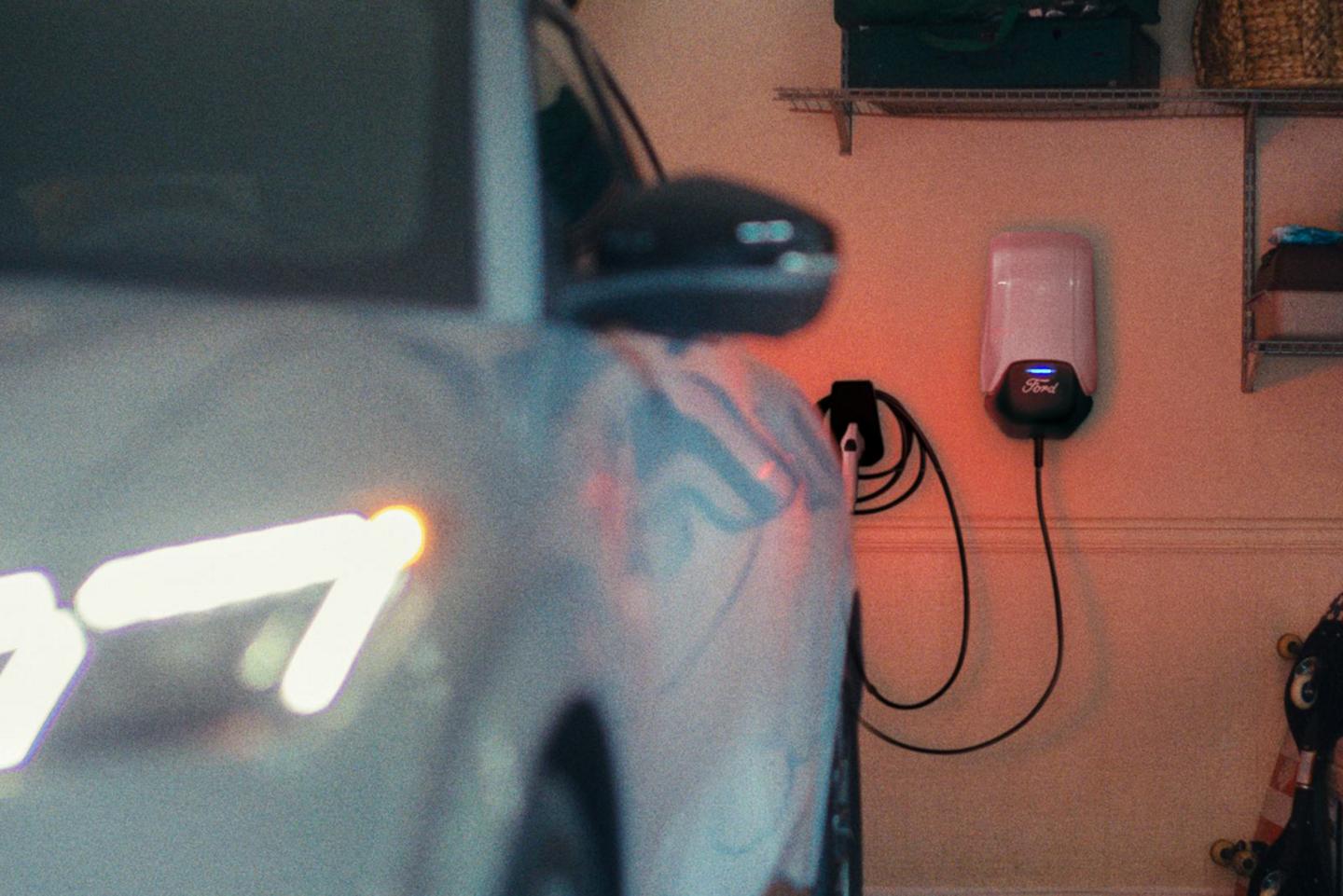 Mustang Mach-E parked in a residential garage in front of a Connected Charge Station.