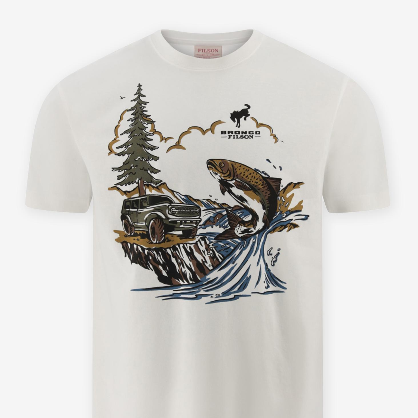 The front of a cream t-shirt illustrated with a forest scene showing a jumping salmon, an SUV, and the Bronco® Filson logo