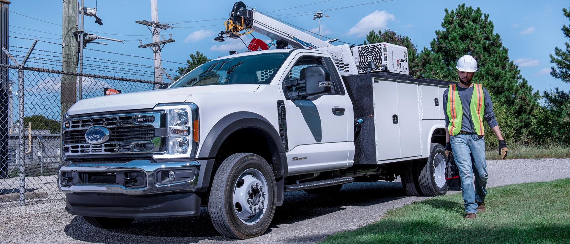 A 2026 Ford Super Duty® Chassis Cab with a boom extension and utility box on it