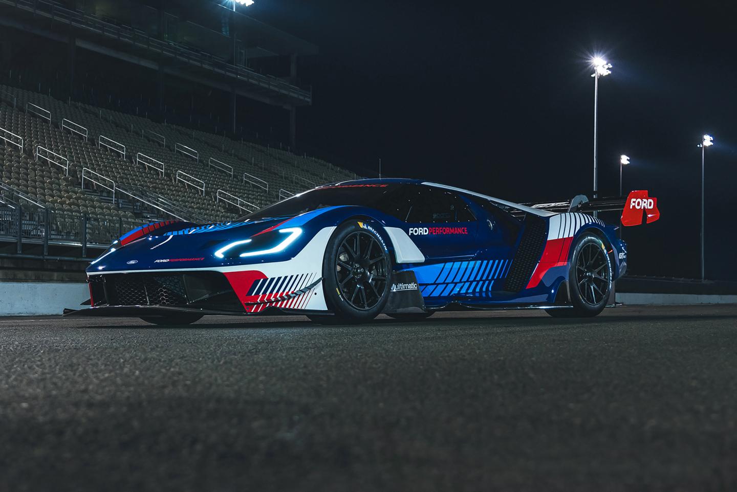 GT Mk IV parked on a racetrack at night.