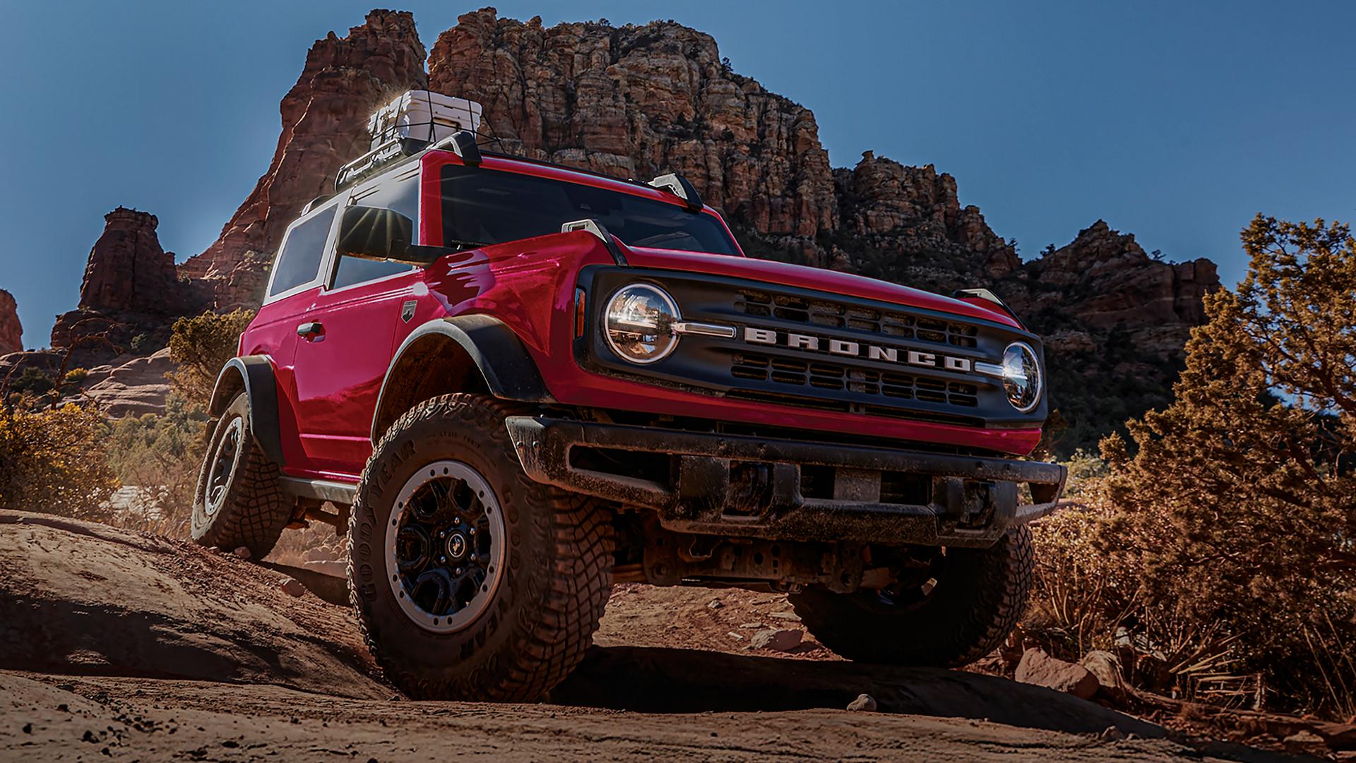 A 2026 Ford Bronco® SUV with the available Sasquatch® Package descending a muddy hill