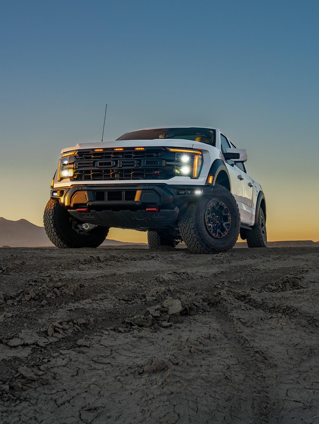 F-150 Raptor parked on a gravel hill.